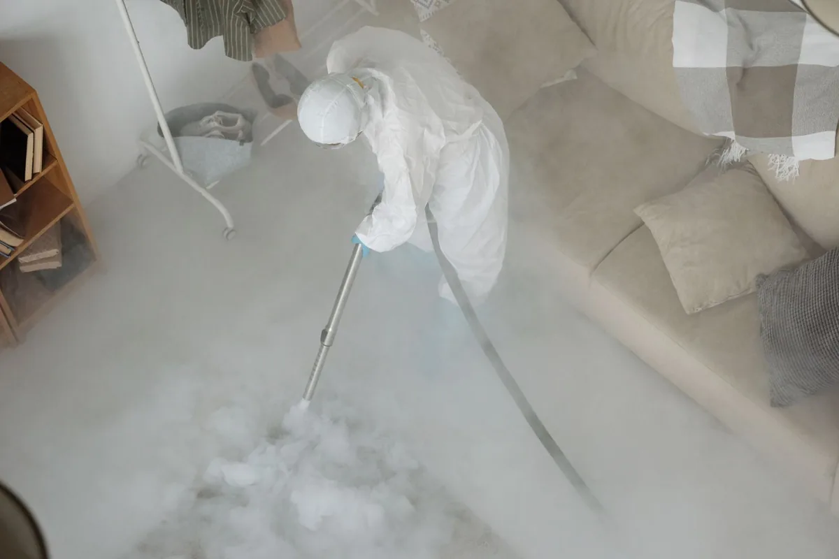 Biohazard cleanup technician in protective equipment, Cecilia, LA